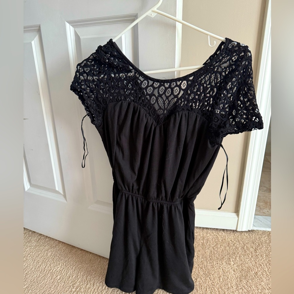 Black (shorts) romper with lace top.